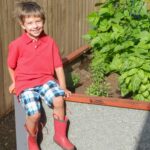 Kid sitting on a bed